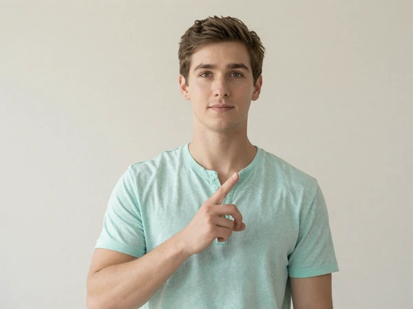 Ethan, a hearing ASL learner and ally on the InclusiveDating deaf dating community, signing toward camera